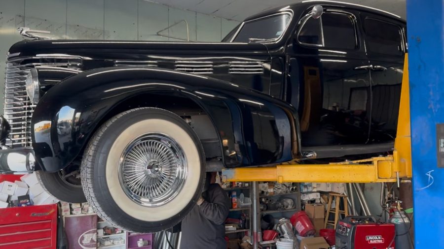 Classic Cadillac up on the lift for undercarriage work